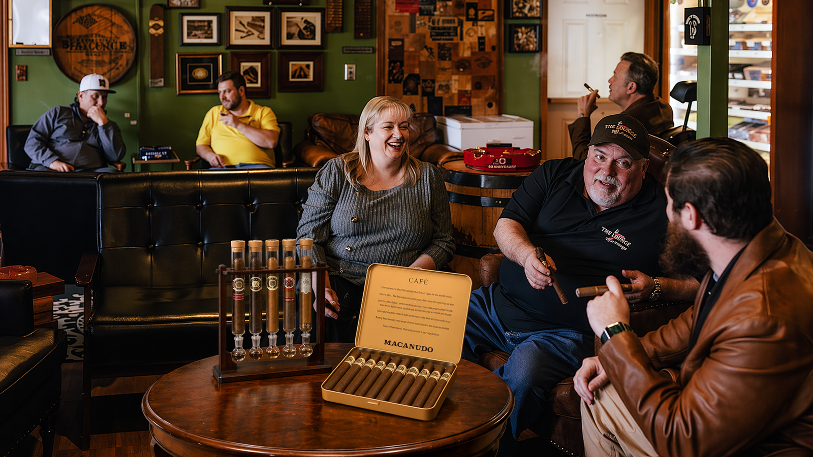 How I Upgraded My Everyday Macanudo Café with SikarInfuse Pentafuser Cigar Flavor Infuser Humidor 2 Cigar lounge scene with a SikarInfuse Pentafuser cigar flavor infuser, open cigar box, and guests enjoying cigars
